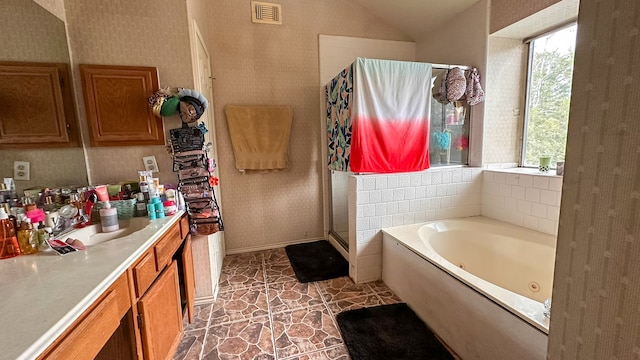 bathroom with plus walk in shower and vanity