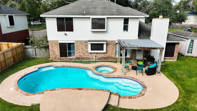 view of swimming pool with outdoor lounge area, a patio area, and an in ground hot tub