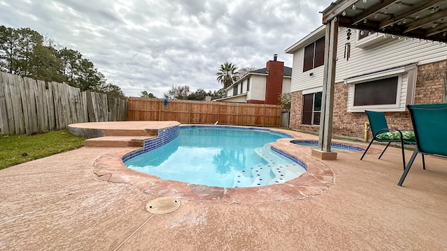 view of swimming pool featuring a patio