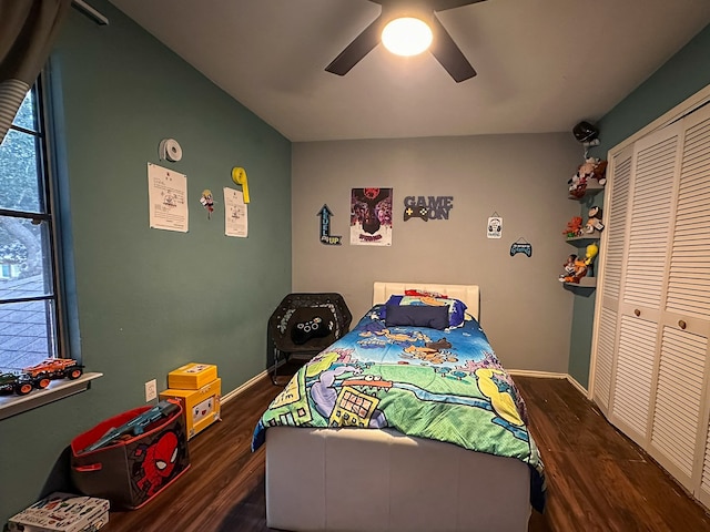 bedroom featuring dark hardwood / wood-style flooring, a closet, and ceiling fan