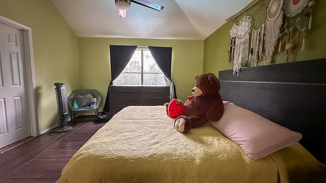 bedroom featuring hardwood / wood-style floors, ceiling fan, and lofted ceiling