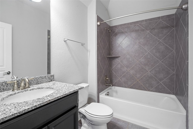 full bathroom with vanity, toilet, and tiled shower / bath