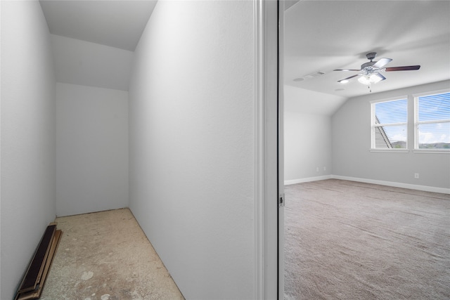 additional living space with ceiling fan, light carpet, and vaulted ceiling