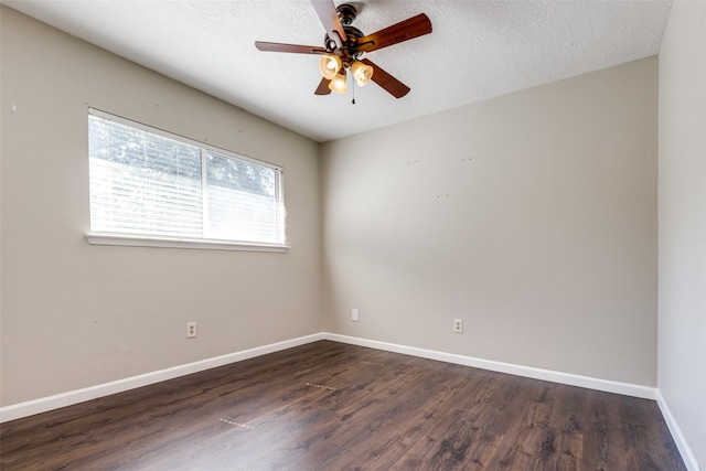 spare room with a textured ceiling, dark hardwood / wood-style flooring, and ceiling fan