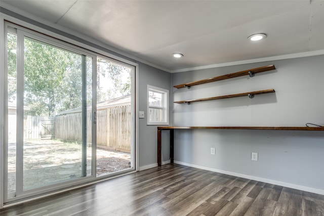 interior space with hardwood / wood-style flooring, crown molding, and a wealth of natural light