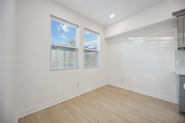 unfurnished dining area featuring light hardwood / wood-style floors