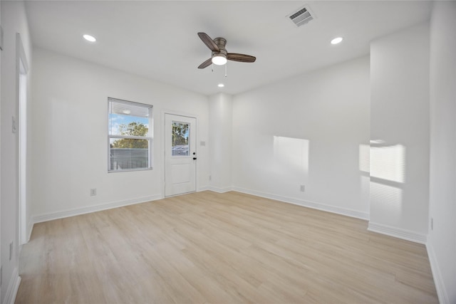 unfurnished room featuring recessed lighting, visible vents, a ceiling fan, light wood-type flooring, and baseboards