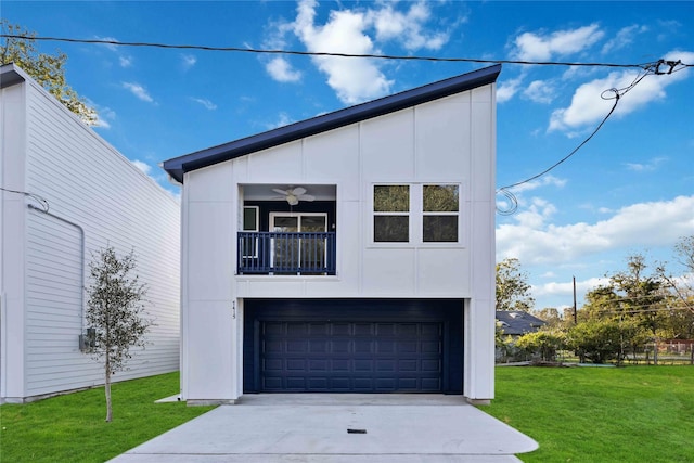 view of front of home featuring ceiling fan, a balcony, a front yard, and a garage