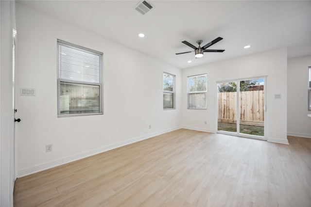 unfurnished room featuring recessed lighting, visible vents, light wood-style flooring, ceiling fan, and baseboards