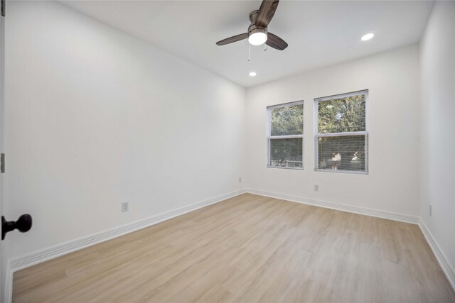 unfurnished room featuring ceiling fan and light wood-type flooring