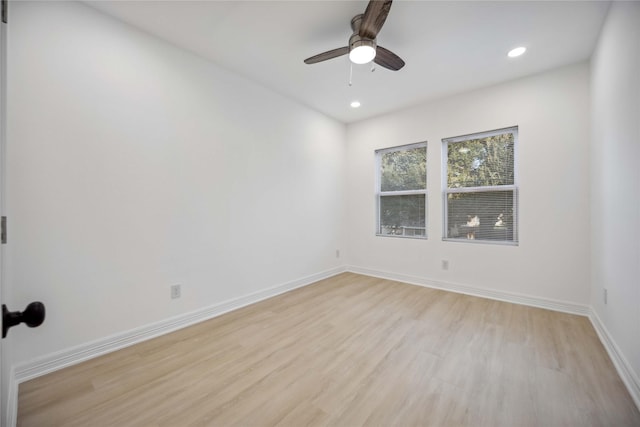 unfurnished room featuring a ceiling fan, recessed lighting, light wood-style flooring, and baseboards