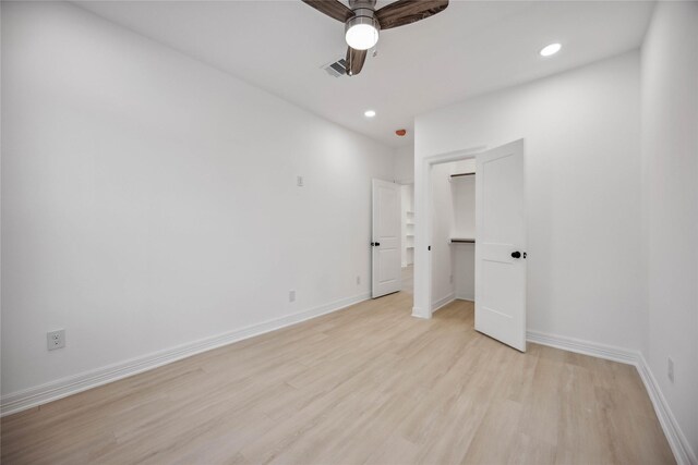 unfurnished bedroom featuring ceiling fan and light hardwood / wood-style floors