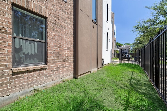 view of home's exterior with a lawn