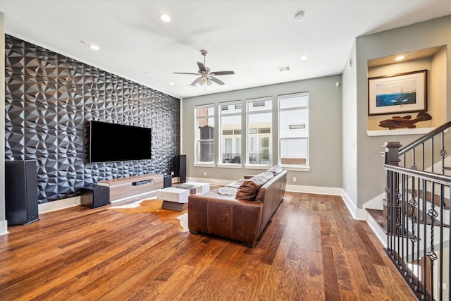 living room with ceiling fan and hardwood / wood-style floors