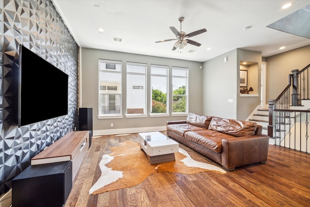 living room with hardwood / wood-style floors and ceiling fan