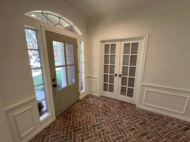 doorway with french doors and ornamental molding