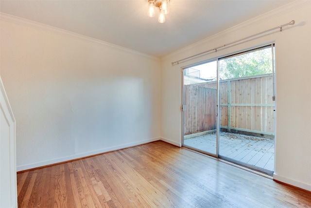 spare room with light hardwood / wood-style flooring and ornamental molding