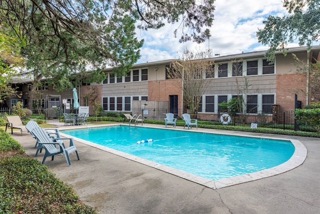 view of swimming pool with a patio area