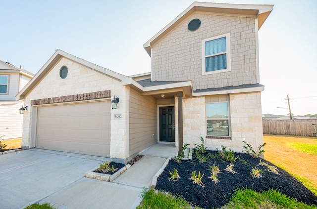 view of front of property featuring a garage