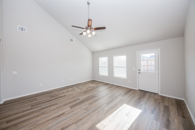 unfurnished living room with light hardwood / wood-style floors, high vaulted ceiling, and ceiling fan