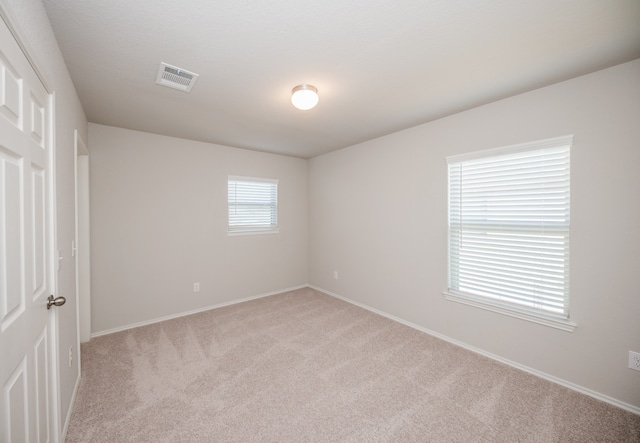 view of carpeted spare room