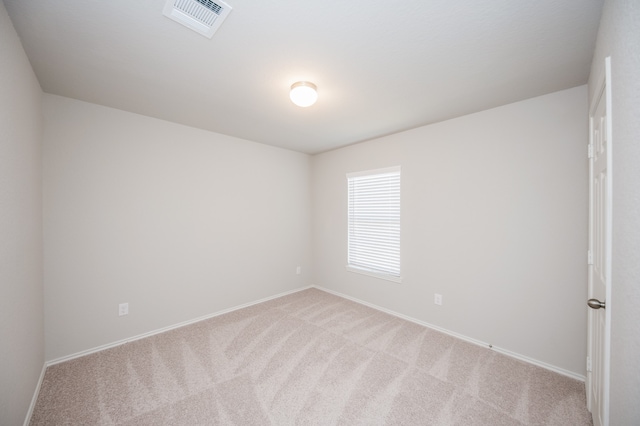 empty room featuring light colored carpet