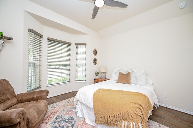 bedroom featuring ceiling fan and dark wood-type flooring