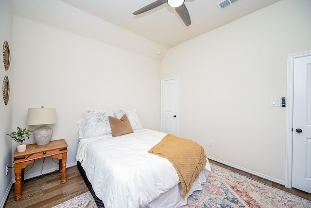 bedroom featuring vaulted ceiling, ceiling fan, and dark hardwood / wood-style floors