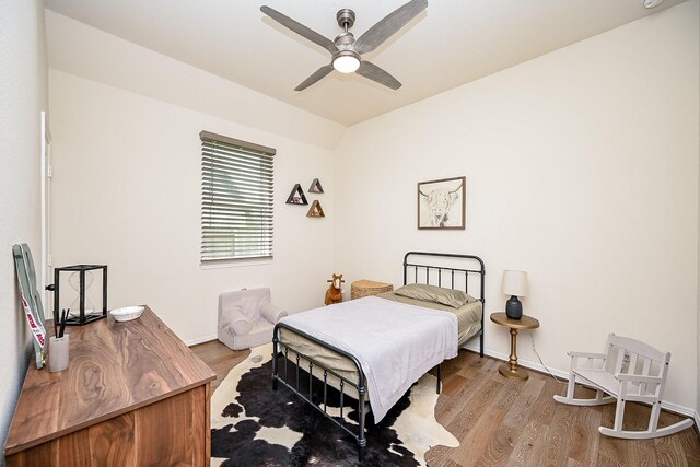 bedroom with ceiling fan and light hardwood / wood-style floors