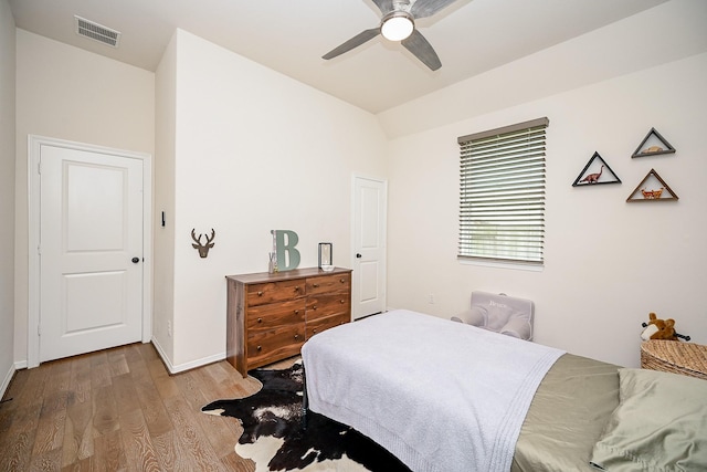 bedroom featuring hardwood / wood-style floors and ceiling fan