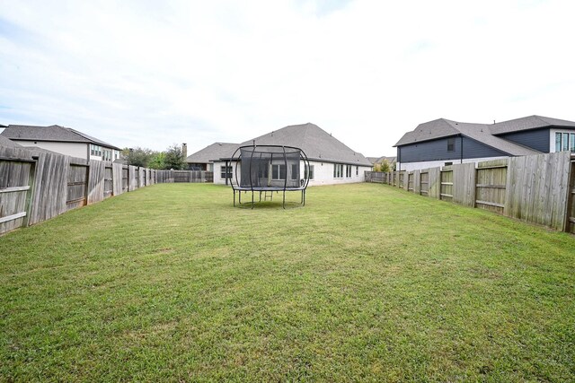 view of yard featuring a trampoline