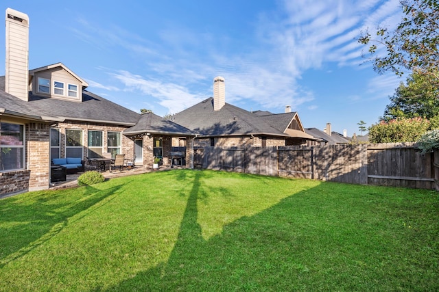 view of yard featuring an outdoor living space and a patio