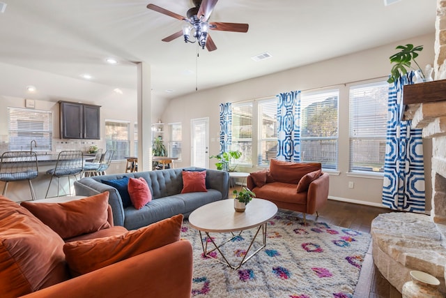 living room with sink, dark hardwood / wood-style flooring, a fireplace, and ceiling fan