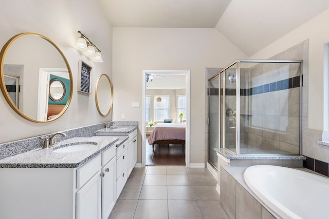 bathroom featuring vaulted ceiling, vanity, tile patterned floors, ceiling fan, and separate shower and tub