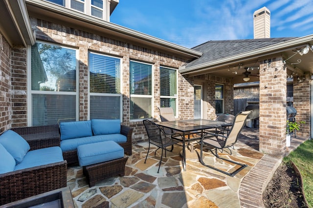 view of patio with ceiling fan and an outdoor living space