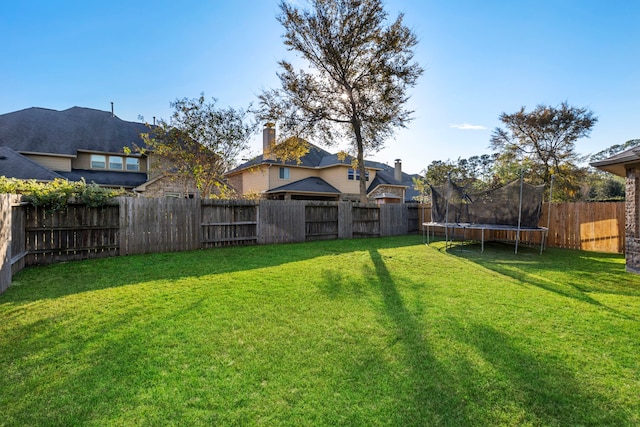 view of yard featuring a trampoline