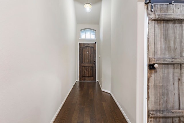 doorway with dark wood-type flooring