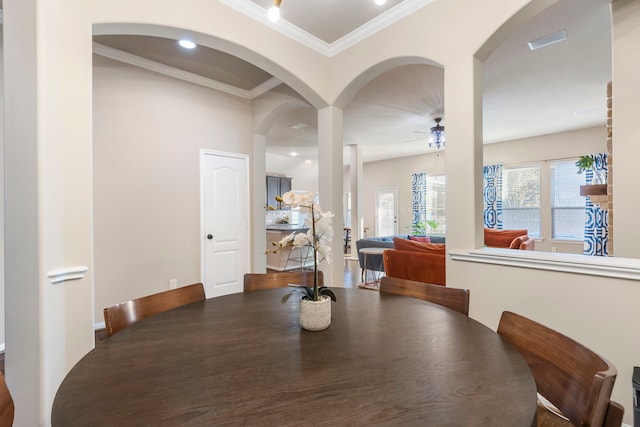 dining room featuring ceiling fan and crown molding