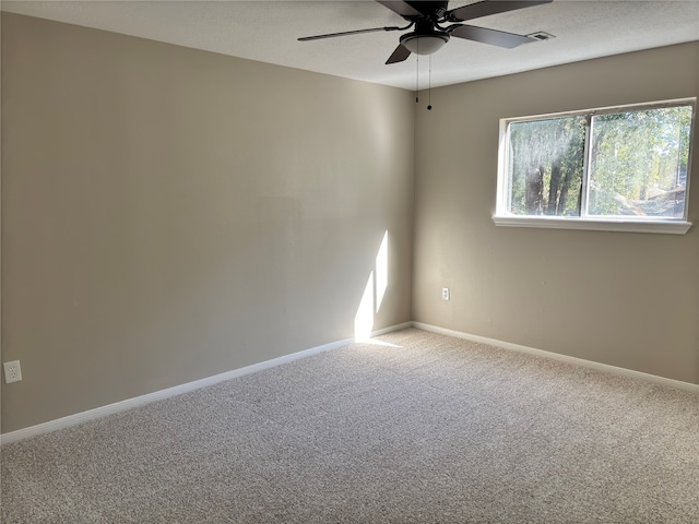 carpeted empty room with ceiling fan