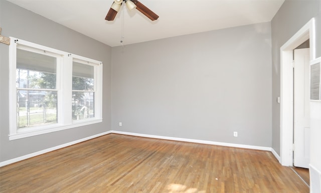 spare room with wood-type flooring and ceiling fan