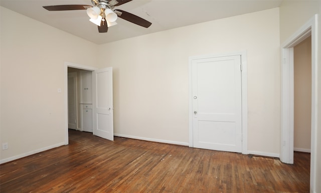 unfurnished bedroom with ceiling fan and dark hardwood / wood-style floors