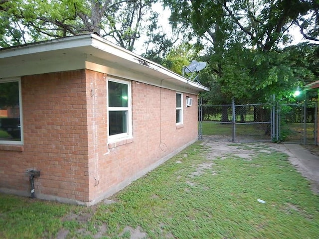 view of side of property with a lawn