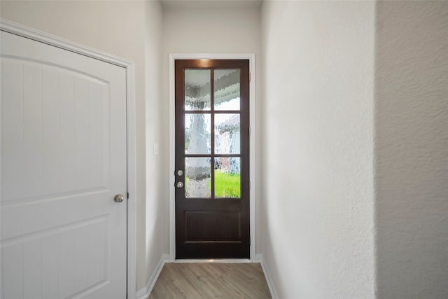 doorway to outside with light hardwood / wood-style flooring