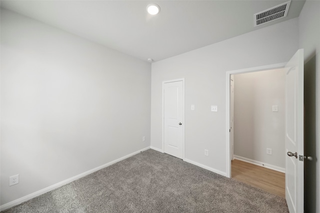 unfurnished bedroom featuring carpet flooring