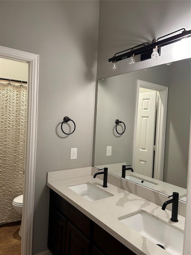 bathroom with vanity and toilet