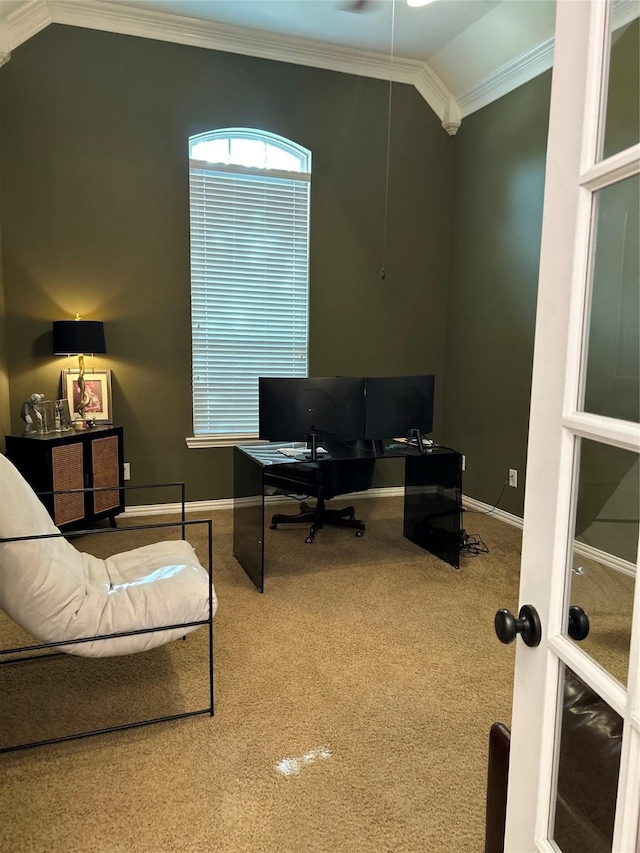 carpeted office space featuring vaulted ceiling and crown molding