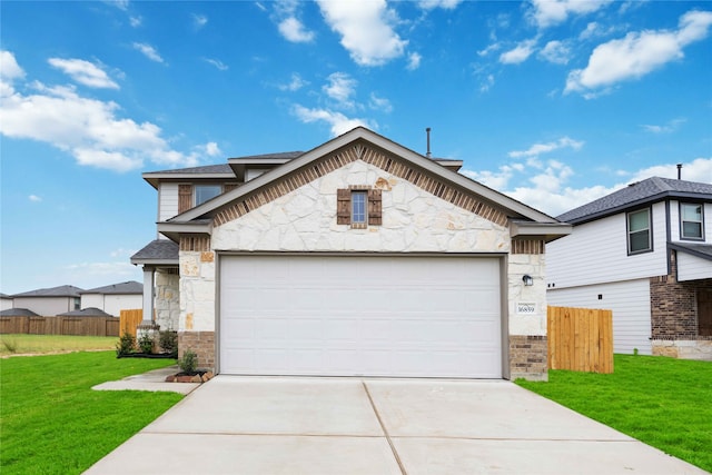 view of front of property with a garage and a front lawn