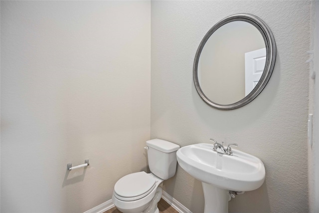 bathroom with sink and toilet