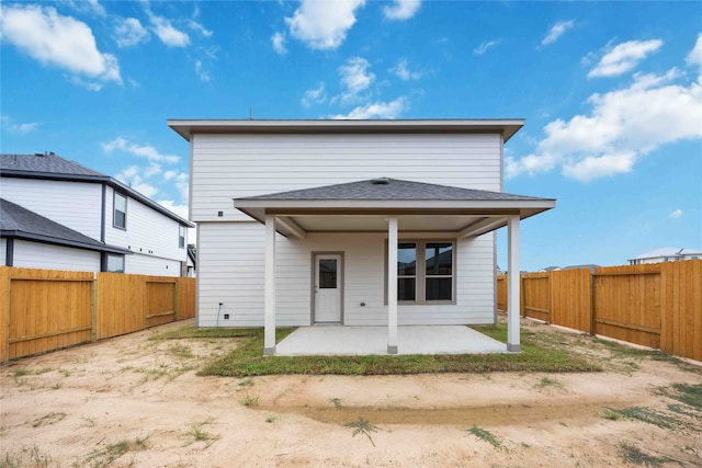 rear view of property featuring a patio area