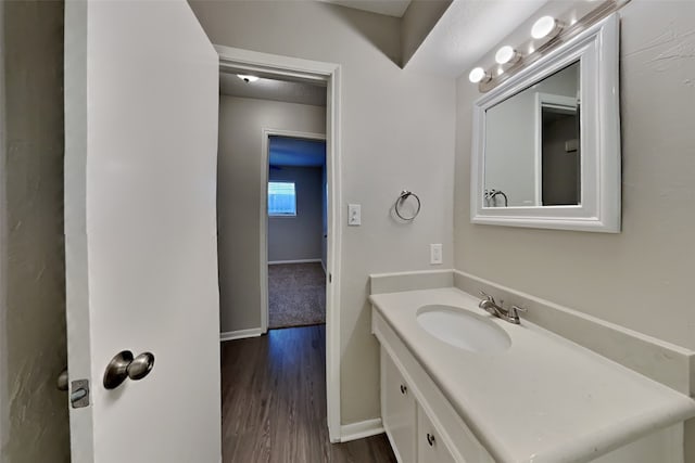 bathroom featuring vanity and hardwood / wood-style flooring